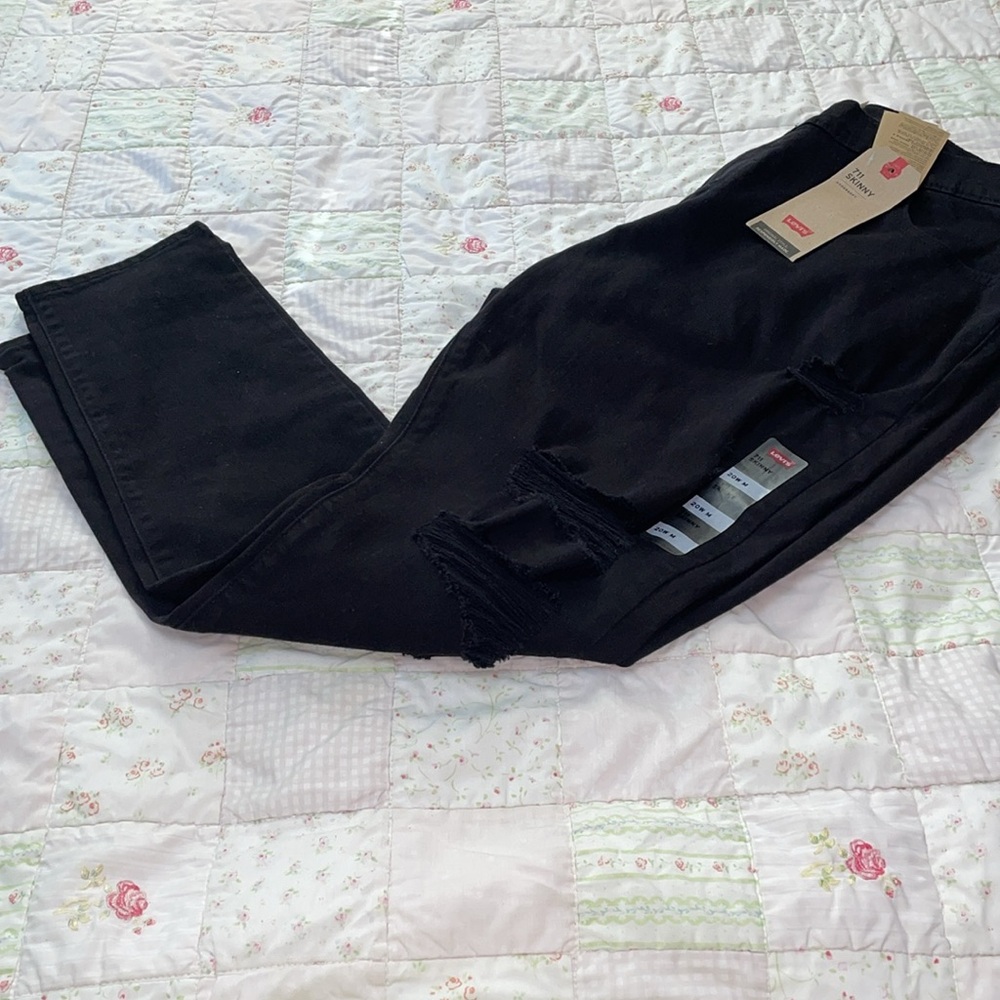 Levi’s 711 black skinny distressed jeans